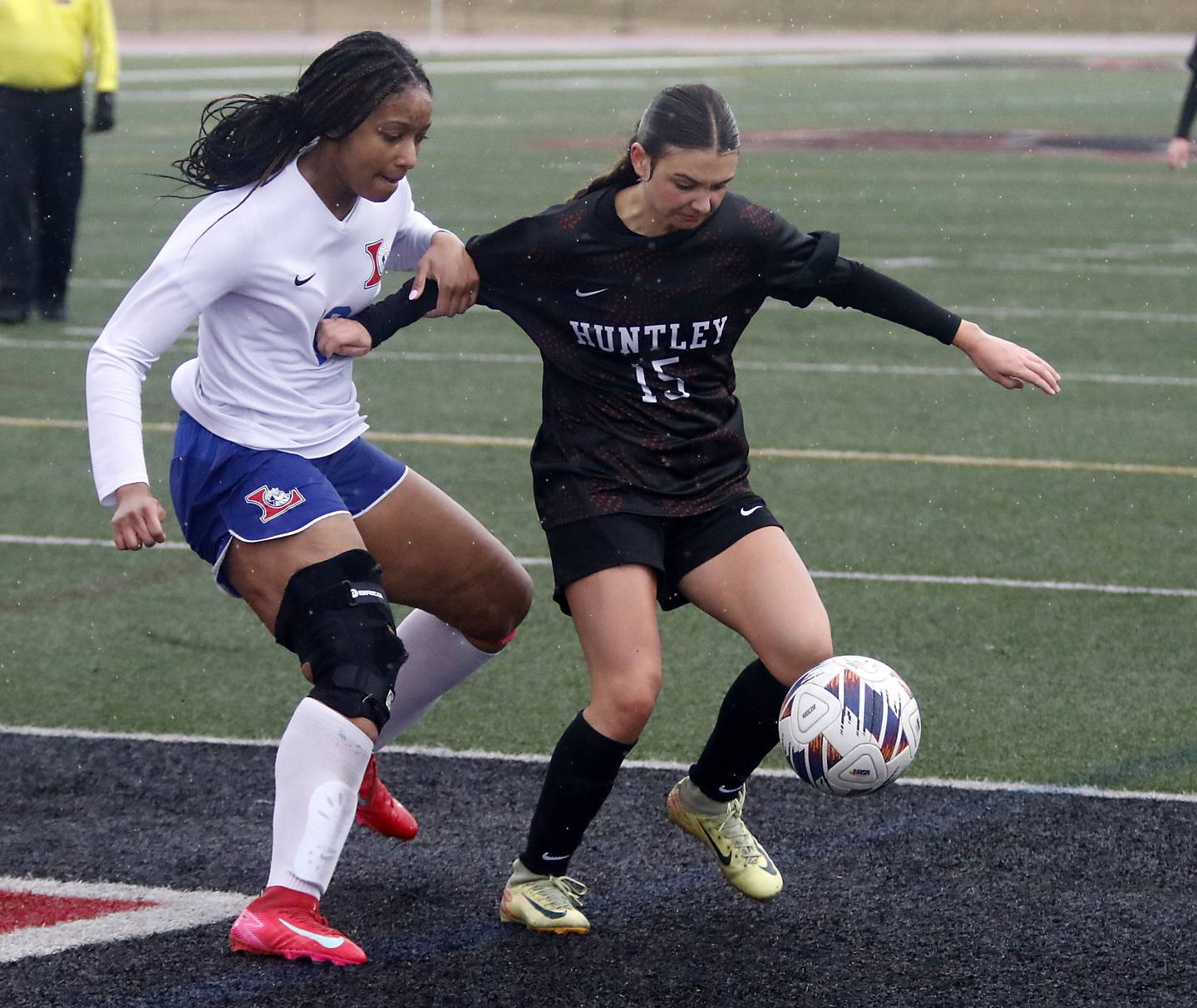 Larkin’s Amethyst Elliot battles with Huntley’s Mia Moyer for control of the ball during a nonconference soccer match on Thursday, March 26, 2026, at Huntley High School.