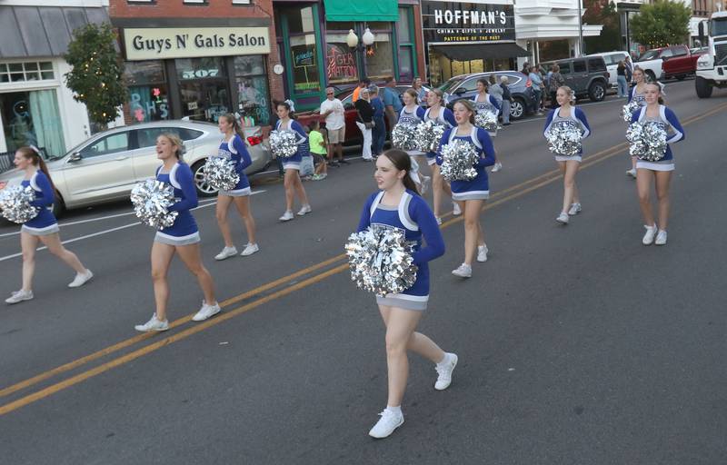 The Princeton High School cheerleaders march during the homecoming parade on Thursday, Sept. 25, 2025 along South Main Street in Princeton .