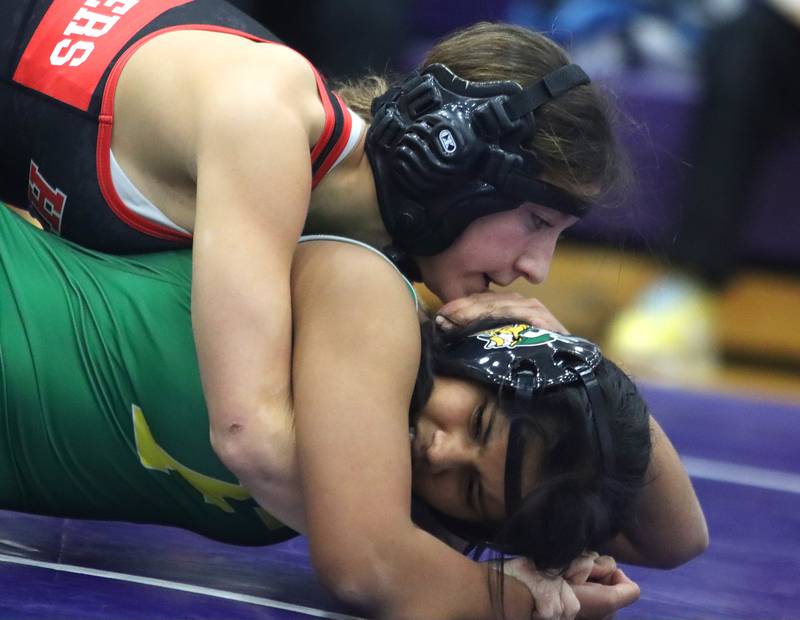 Huntley’s Isabelle Singer, top, battles Fremd’s Trisha Yadav at 120 pounds in IHSA Regional wrestling action on Saturday, Feb. 1, 2025, at  Hampshire High School  in Hampshire.