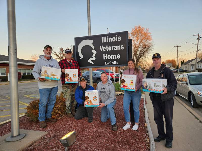 (From left) Wenona American Legion Post 8 members Dale Peters, James “Tiger” Lauf, George Volker, Eddie Harezlak, Illinois Veterans Home Volunteer Coordinator Bailie Bongartz and Commander Jeff Blessington.