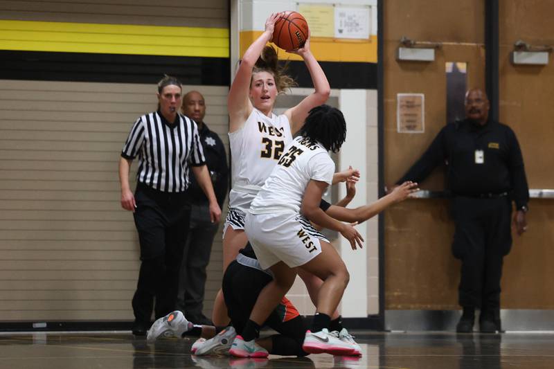 Joliet West’s Brook Schwall looks to pass off the rebound against Plainfield East on Thursday, February 2nd.