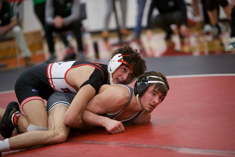 Yorkville's Dominick Coronado competes with Plainfield Central's Mathias Hautzinger   in the 144 lb. class Final at the Class 3A Regional on Saturday, Feb.3,2024 in Yorkville.