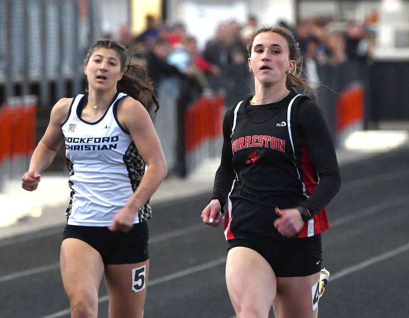 Forreston-Polo's Bree Schneiderman (right) crosses the finish line first ahead of Rockford Christian's Lucy Gargani in the 100 meters finals at the 1A Winnebago Sectional on Wednesday, May 13, 2026.
