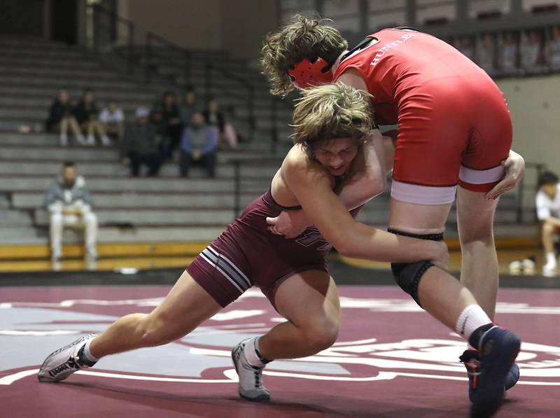 Prairie Ridge’s Jacob Meade takes down Huntley’s Maciej Rybarski during the 165-pound match of a Fox Valley Conference boys wrestling meet on Thursday, Jan. 22, 2026, at Prairie Ridge High School Crystal Lake.