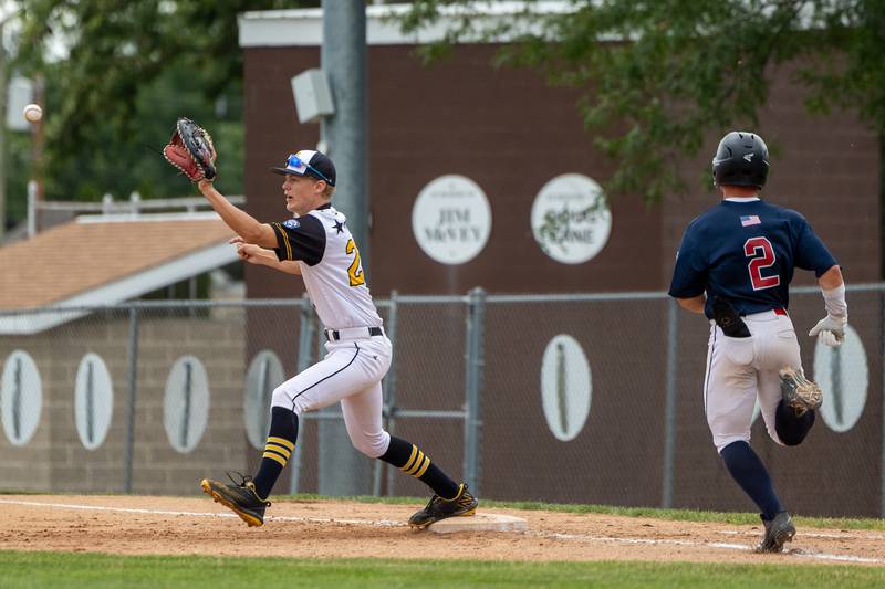 Ryan Lotus (2) of Illinois runs to first base as Bryan Degen (22) of Iowa attempts to tag out on Thursday, July 17, 2025 at Washington Park in Peru.
