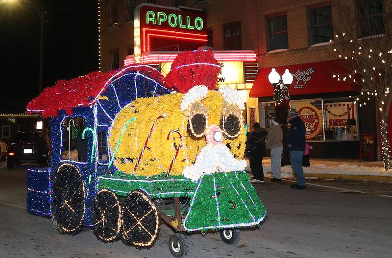 A light up train engine strolls down Main Street d uring the "Night of Lights" parade on Friday, Dec. 5, 2025 downtown Princeton. The event featured the Christmas tree lighting at Veterans Park a lighted Christmas parade down Main Street,  Living Windows, a Candy Cane Hunt, and visits with Santa.