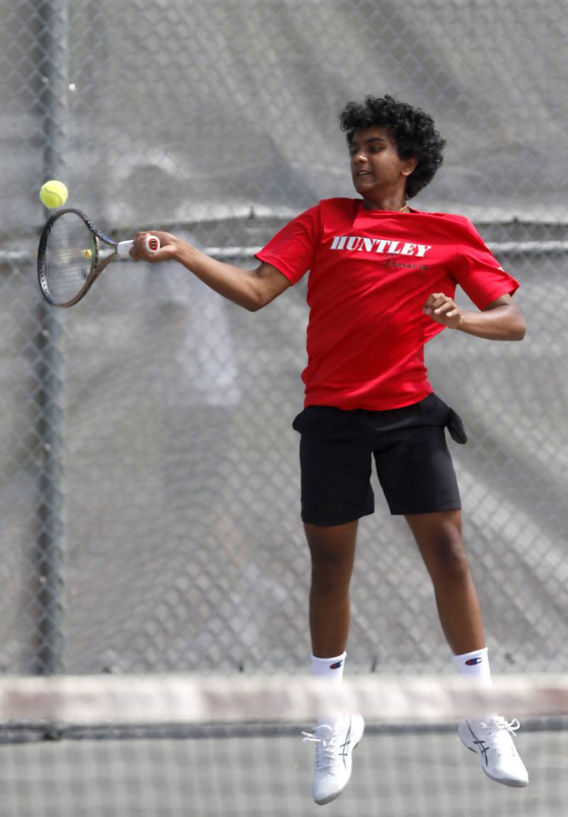 Huntley’s Vivek Yandamuri returns the ball as he and his doubles partner, Tanush Gulati,  competes in the Class 2A Boys State Tennis Tournament on Thursday, May 29, 2025, at Palatine High School.