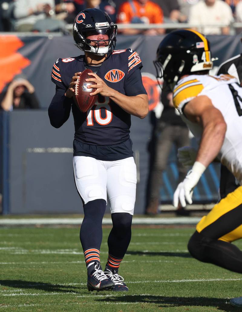 Chicago Bears quarterback Caleb Williams looks for a receiver Sunday, Nov. 23, 2025, during their game against the Pittsburgh Steelers at Soldier Field in Chicago.