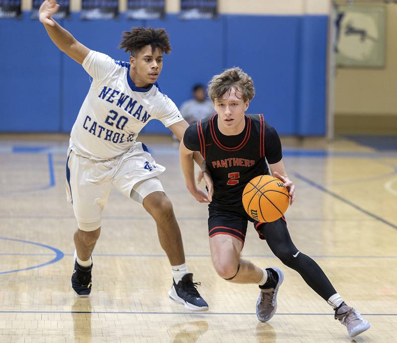 Newman’s Tyson Williams works against Erie-Prophetstown’s Connor Keegan Wednesday, Jan. 29, 2025, at Newman High School.