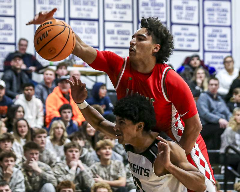 LaSalle Peru's Marion Persich (24) reaches for a ball before it goes out of bounds during their Plano Christmas Classic semi-final basketball game between Kaneland at LaSalle Peru Monday, Dec 29, 2025 in Plano.