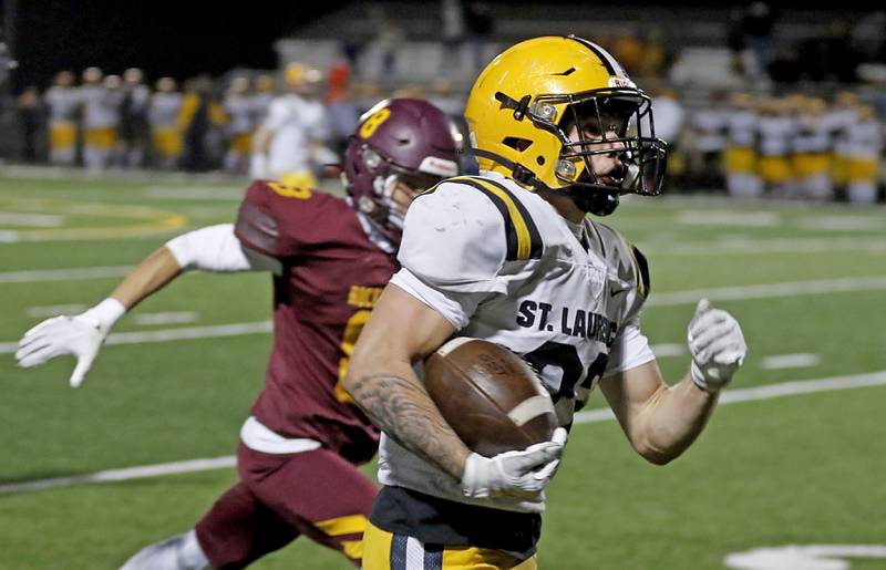 Richmond-Burton's Gavin Busa out sprints Richmond-Burton's Joseph Larsen as he runs for a touchdown during an IHSA Class 4A first-round football game on Friday, Nov. 1, 2024, at Richmond-Burton High School in Richmond.