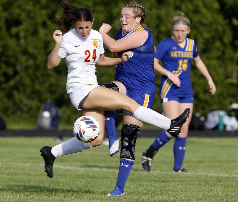 Johnsburg's Natalie Oeffling blocks the ball from getting to Johnsburg's Mackenzie McQuiston during the IHSA Class 1A Marian Central Sectional Championship match on Tuesday, May 21, 2024, at Marian Central High School.