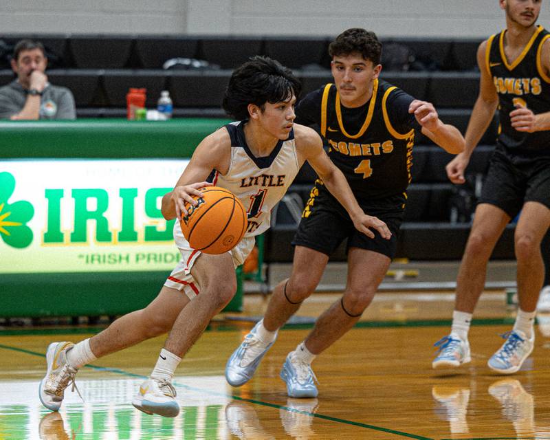 Pedro Lopez (1) of DePue dribbles ball past Chase Isaac (4) of Reed-Custer during game in the Shipyard Showdown on Tuesday, December 23, 2025 at Seneca High School in Seneca.