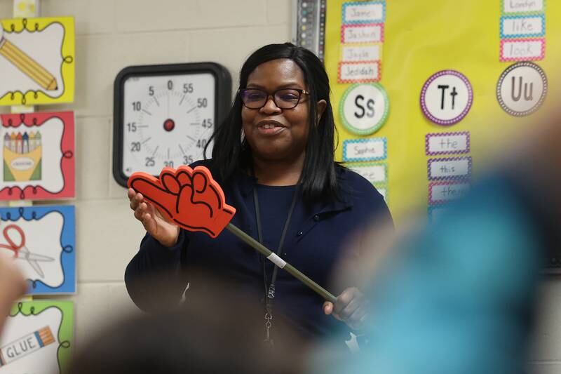 Jennifer Foster listens to a student’s answer in her classroom at KL Hermansen Elementary in Romeoville.