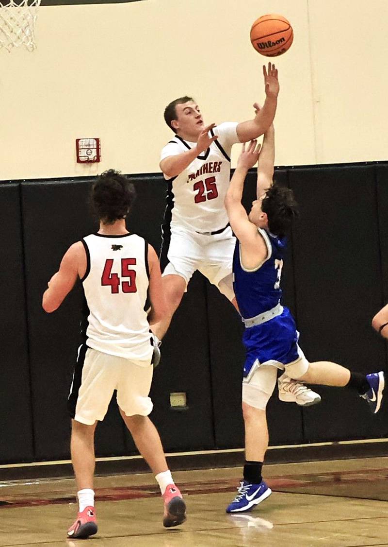 EP’s Derek Naftzger launches up to block Garret Matznick's shot Wednesday, Jan. 28, 2026,  in Prophetstown. The Panthers were hoping to give the Comets their first loss of the season but fell short, losing 57-49