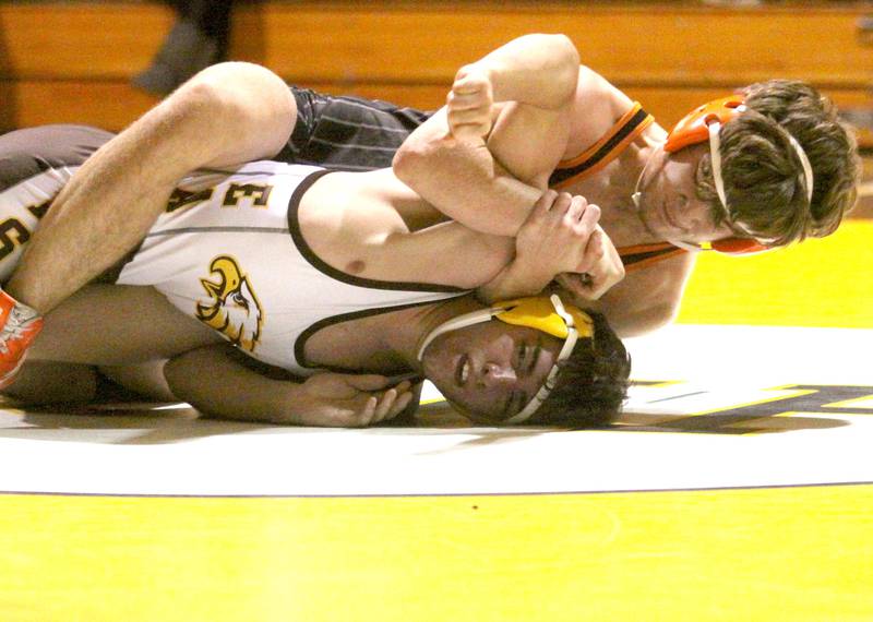Jacobs’ Joel Reyes, front, battles Crystal Lake Central’s Ben Butler at 152 pounds in varsity wrestling Thursday at Algonquin.
