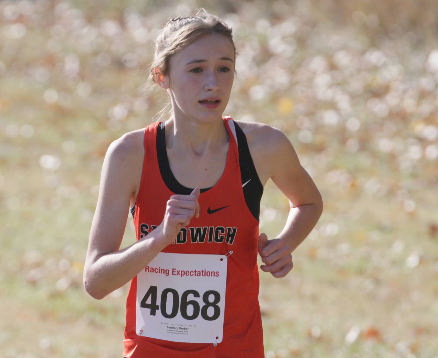 Sandwich's Sundara Weber runs in the Class 1A Regional Cross Country girls race on Saturday, Oct. 22, 2022 at the Seneca FFA Farm in Marseilles.