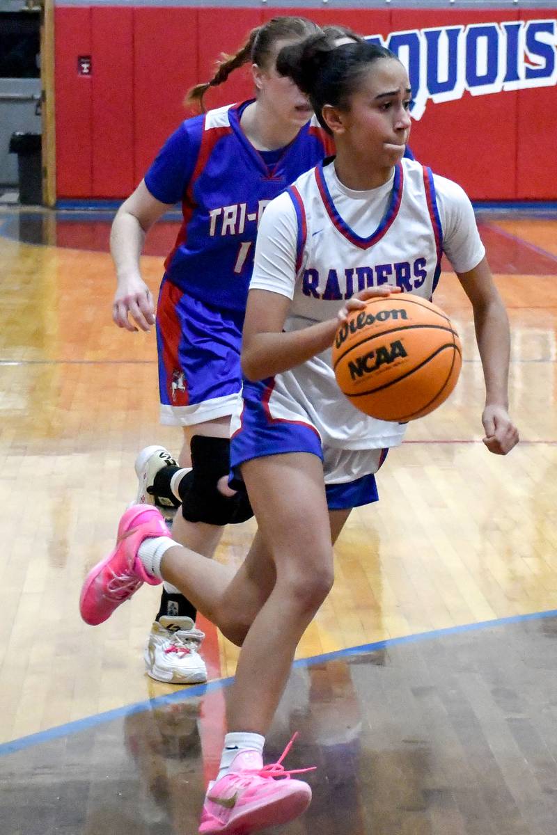 Iroquois West's Elizabeth Izquierdo dribbles towards the basket during Iroquois West's 35-29 win over Tri-Point in the Iroquois West Holiday Tournament on Wednesday, December 17, 2025.