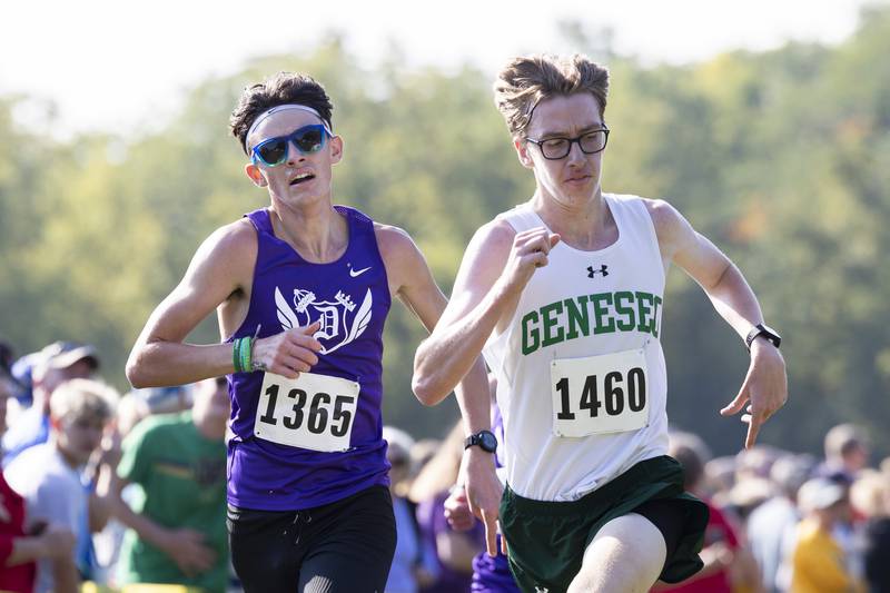 Dixon's Dean Geiger and Geneseo’s Sam Mosbarger battle it out for 5th place Saturday, Sept. 23, 2023 during the Rock River Run in Sterling. Mosbarger took the spot by a hair.