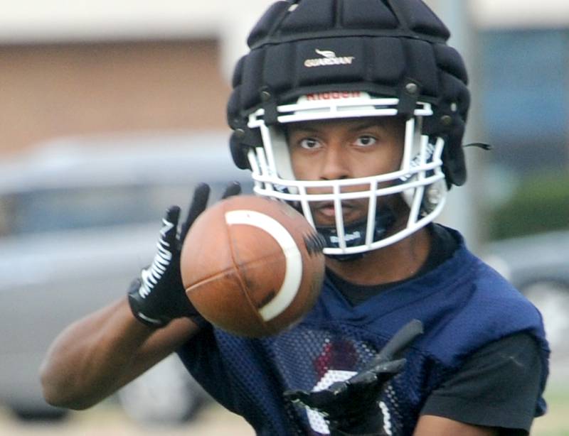Oswego's Deon Seaphus catches a pass during football practice at Oswego High School on Monday, Aug 7, 2023.