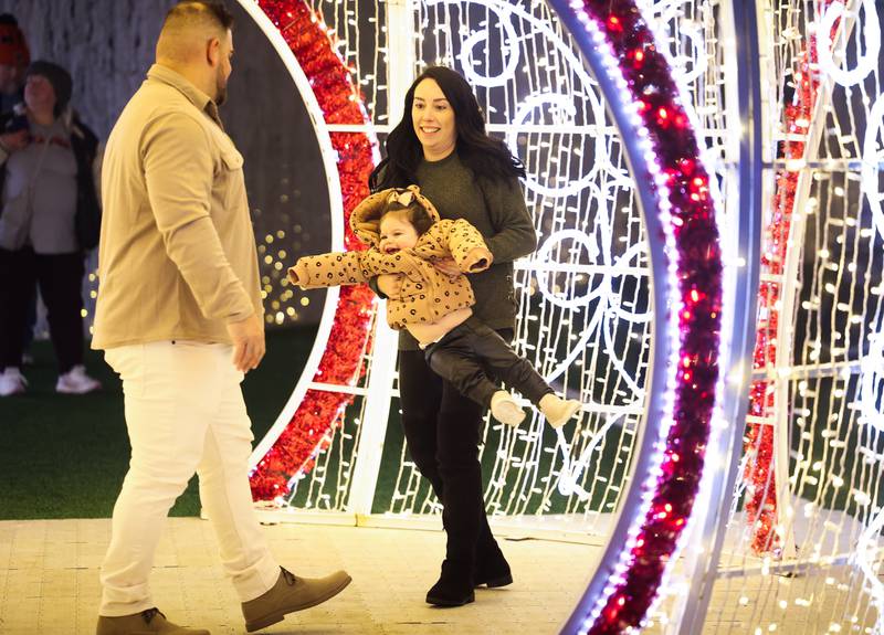 Breann Buonauro spins her daughter Stella at the GLOW Holiday Festival at Slammers Stadium on Wednesday, Nov. 27, 2024 in Joliet.
