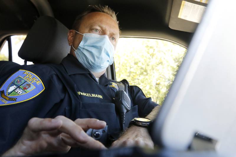 Cary Police Deputy Chief Chris Winklemann monitors traffic with radar, checking license plates as they pass on Tuesday, Sept. 28, 2021 in Cary.