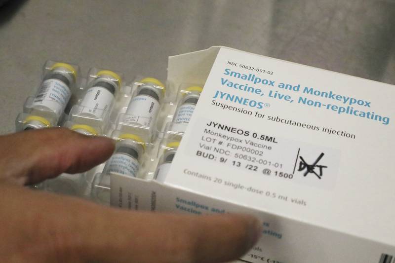 FILE - Jonathan Parducho, a pharmacist, removes a tray of vials of of the Jynneos vaccine for monkeypox from a box containing 20 doses, in the vaccine hub at Zuckerberg San Francisco General Hospital, July 29, 2022, in San Francisco. The U.S. will declare a public health emergency to bolster the federal response to the outbreak of monkeypox that already has infected more than 6,600 Americans. That's according to two people familiar with the matter said. (Lea Suzuki/San Francisco Chronicle via AP)