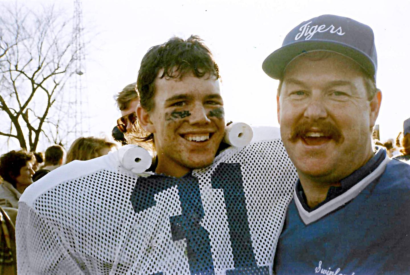 The late Princeton coach Randy Swinford is all smiles with Tiger Jay Alter celebrating their 1989 quarterfinal victory over Rock Island Alleman at Bryant Field.