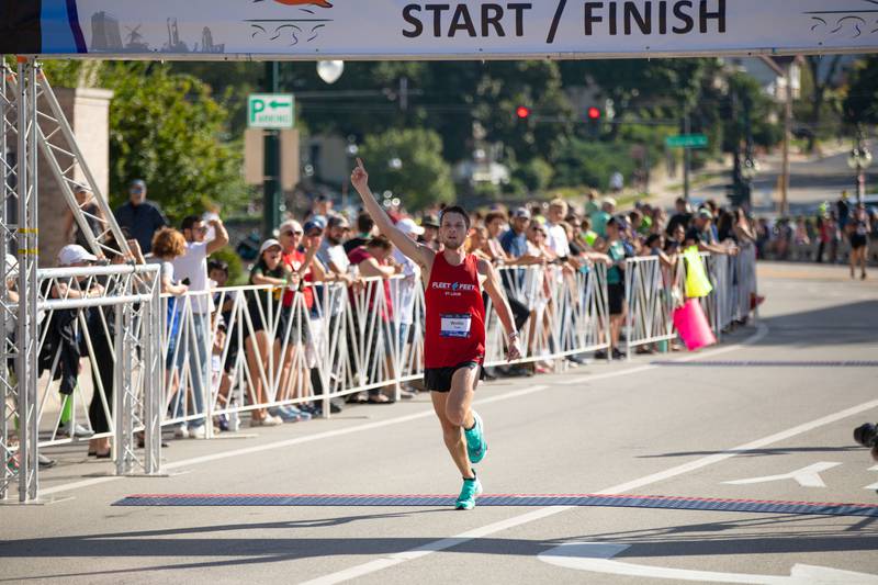 A Fox Valley Marathon runner crosses the finish line on Sunday, Sept. 18, 2022.