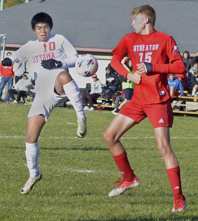 Ottawa’s Michael Bedolla and Streator’s Joe Hoekstra meet to fight for control in the 1st half Tuesday at Streator.