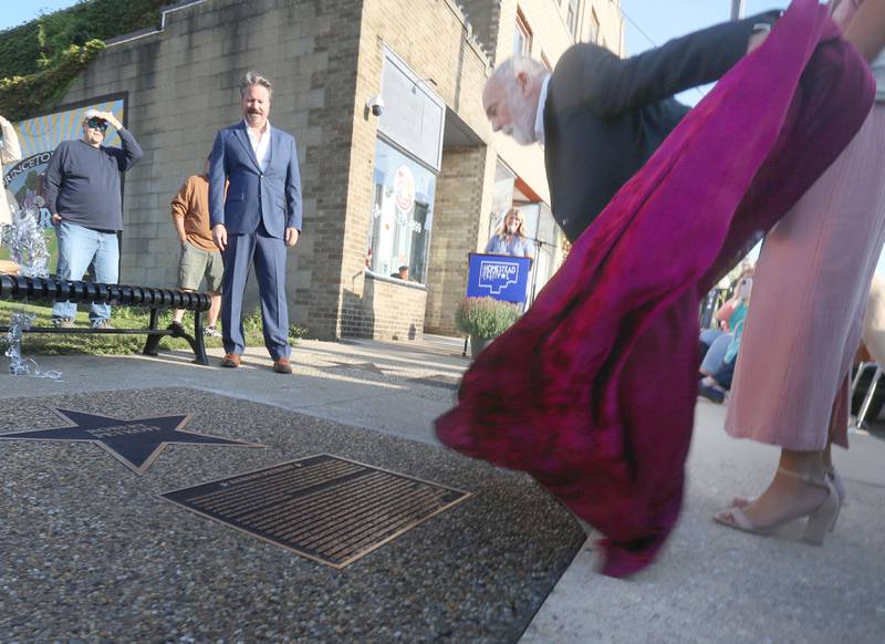 Dan Martinkus, retired drama instructor at Princeton High School, unveils the star for actor Robert Petkoff l(left) during the "Walk of Fame" dedication on Thursday, Sept. 4, 2025 at the Apollo Theater in Princeton. Petkoff was born in Sacramento Calf., and moved to Princeton where he was involved in Princeton High School theater.