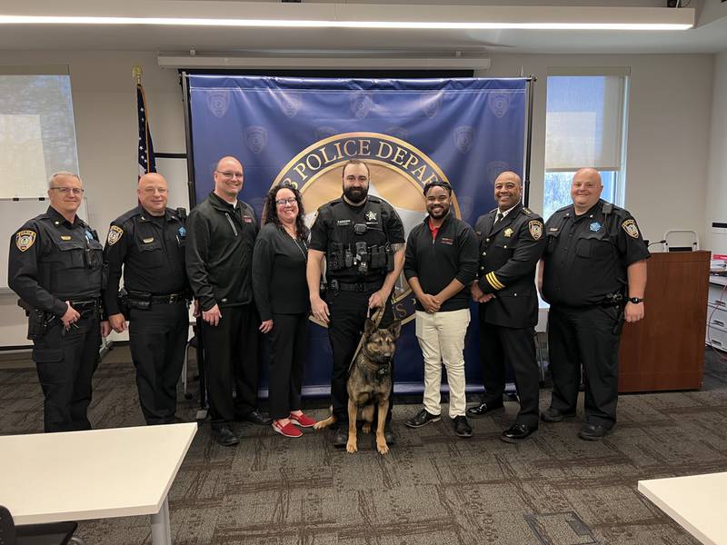 DeKalb Police Department officers, K9 Ronin, and Brian Bemis Toyota of DeKalb employees