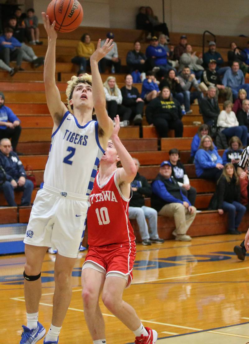 Princeton's Landon Roark runs in front of Ottawa's Evan Snook to score on a layup on Monday, Feb. 5, 2024 at Prouty Gym.