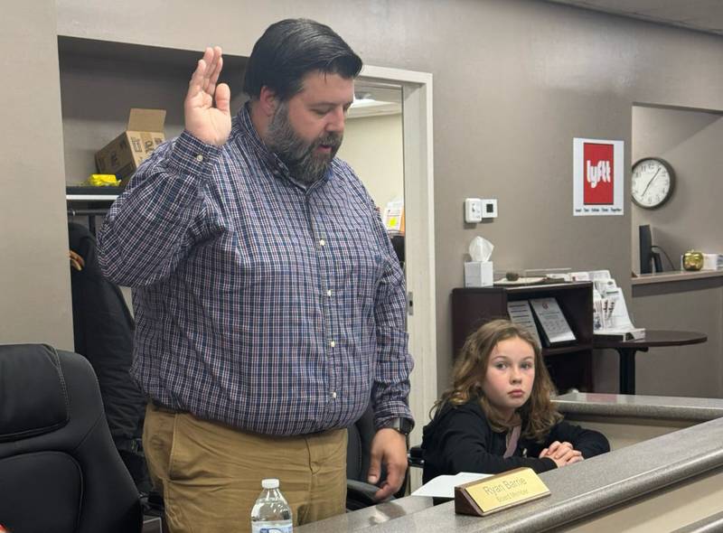 Ryan Barrie takes an oath of office for the Bradley Elementary District 61 School Board on April 30, 2025. Running unopposed, Barrie now takes the place of Mary Fisher, who did not run for re-election to the seven-member board.