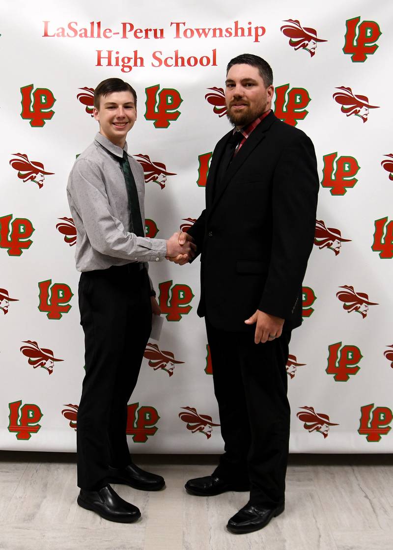John Philip Guglielmetti received the Tirza B. Ennor Mathematics Scholarship from La Salle-Peru High School Math Division Chair Nick Stevenson (right). This scholarship honors Tirza B. Ennor, a former L-P math teacher.