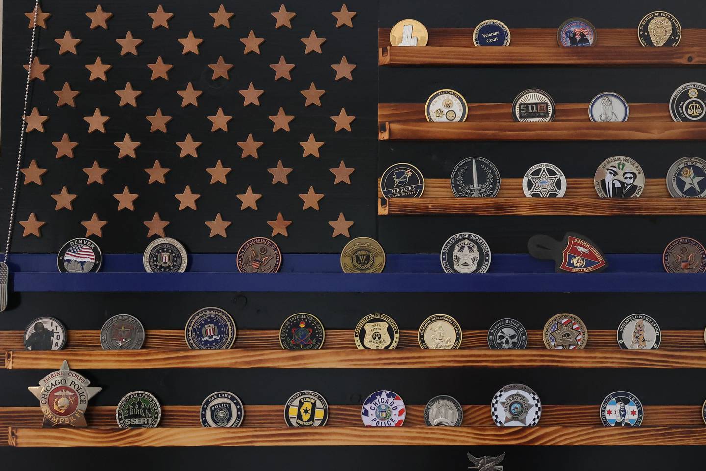 Dan Miller, with the Wounded Warriors Project and K9s for Veterans, was gifted a custom made wood coin display by a veteran Dan had an impact on.
