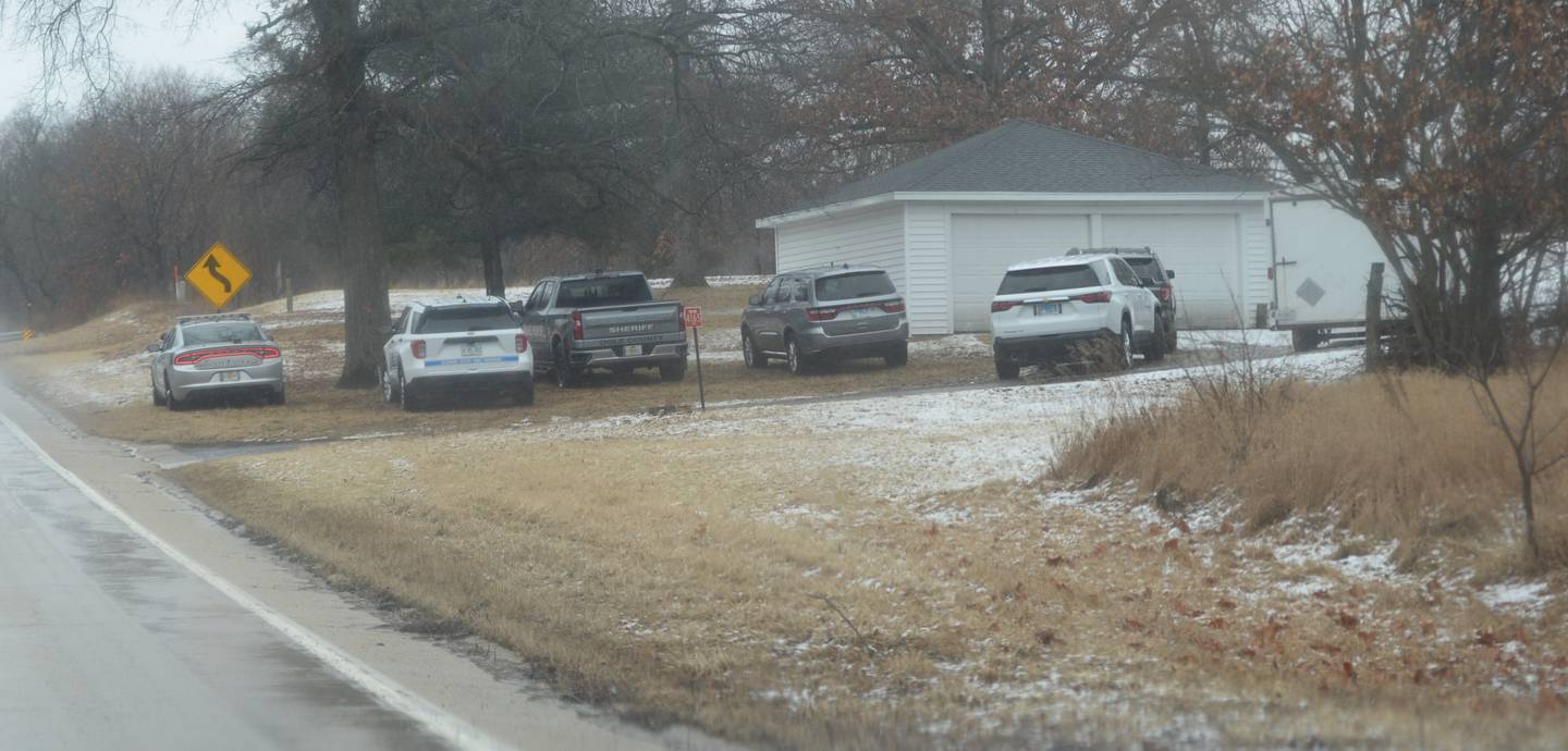 Several law enforcement vehicles could be seen at a home at 4165 E. Illinois 64,, about three miles east of Oregon, on Friday, March 7, 2025. Ogle County Sheriff Brian VanVickle said his office is investigating the report of a deceased person at that location.