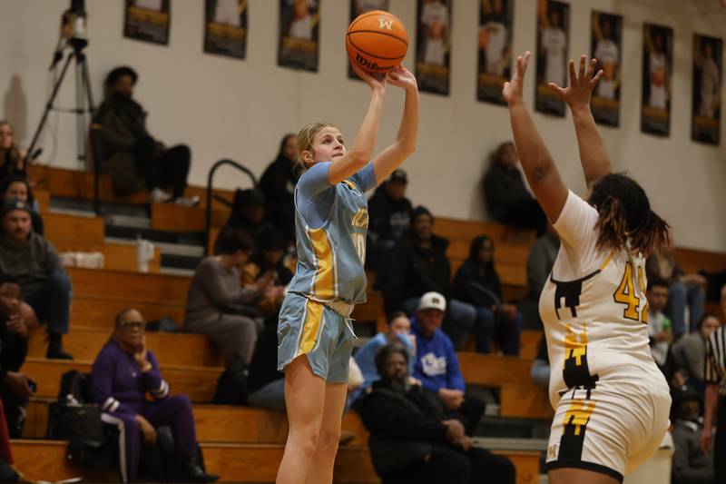Joliet Catholic’s Emma Napier takes the corner shot against Marian Catholic on Wednesday, Jan. 14, 2026 in Chicago Heights.