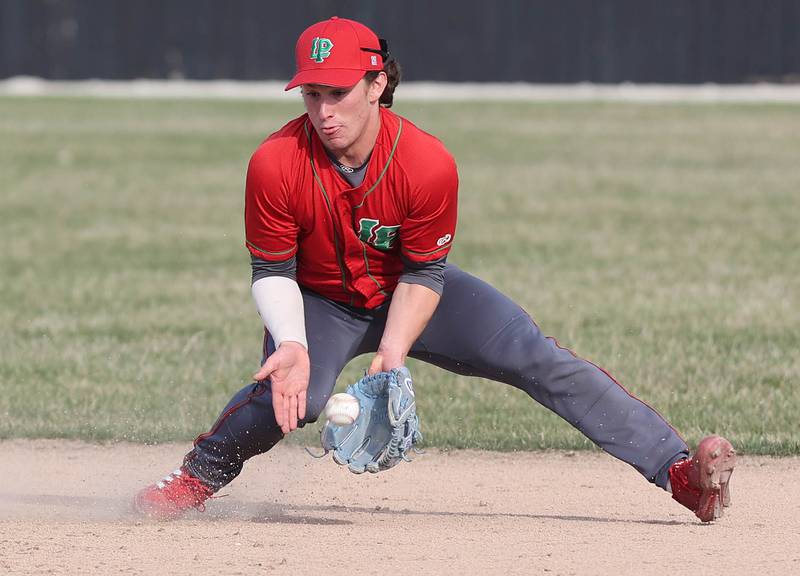 LaSalle-Peru's Jack Scheri fields a hard grounder during their game against Sycamore Monday, April 11, 2022, at the Sycamore Community Sports Complex.