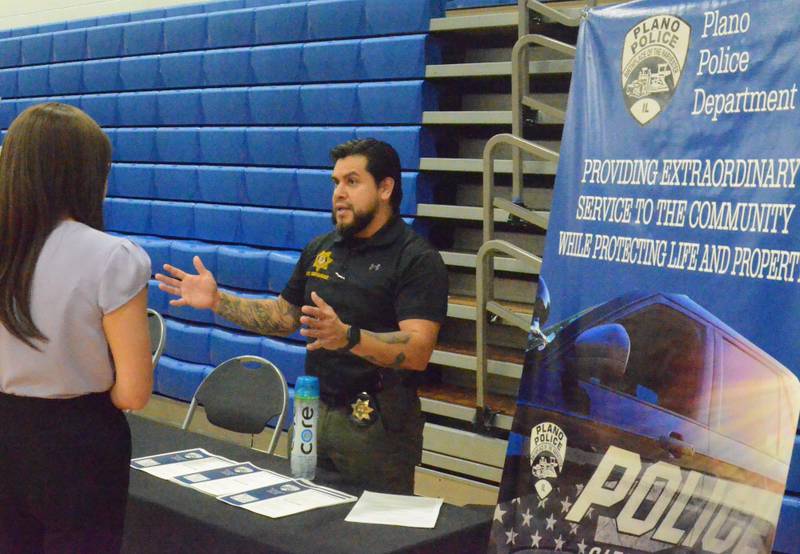 Plano Police Department Sgt. Robert Hernandez at Aurora University's career fair Nov. 9, 2022.