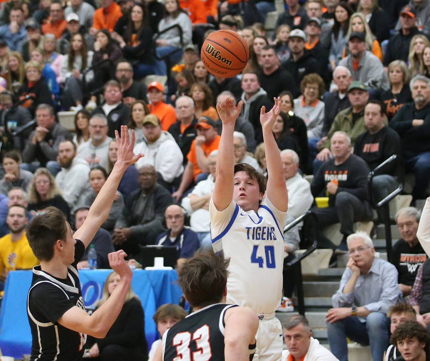 Princeton's Jordan Reinhardt shoots a shot over Byron's Ryan Tucker and Caden Considine during the Class 2A Sectional final on Friday, March 1, 2023 at Mendota High School.