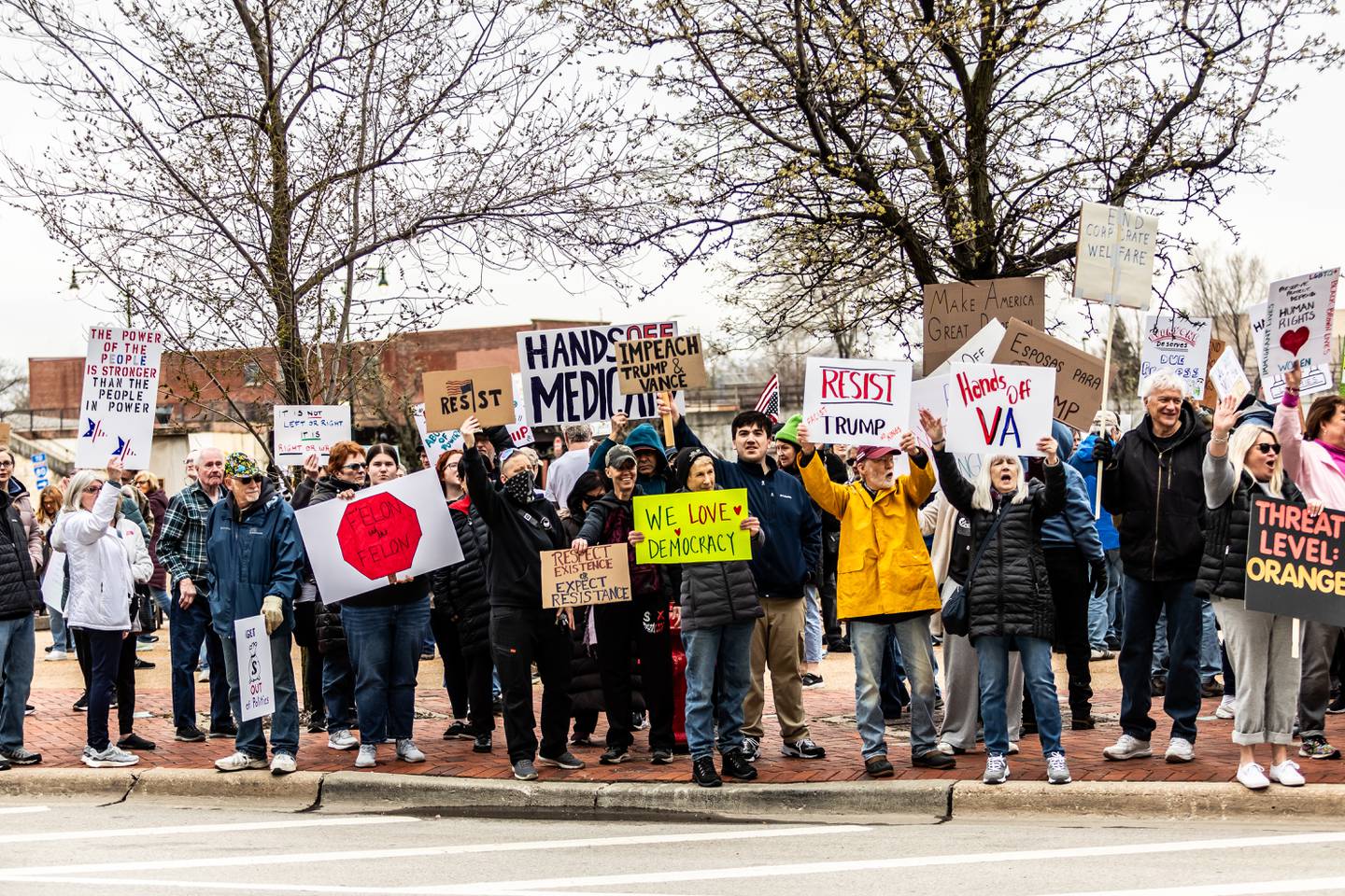 Attendees line Jefferson Street in downtown Joliet during the Hands Off protest on April 5, 2025. The rally was part of a nationwide movement on Saturday to protest policies and actions of the Trump administration and Elon Musk.