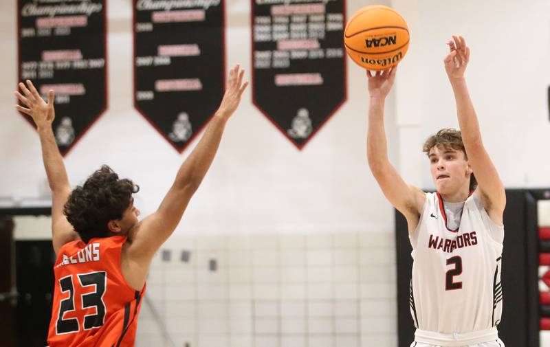 Woodland's Nolan Price shoots a jump shot over Flanagan-Cornell's Rudra Patel during the Route 17 Classic Tournament on Wednesday, Nov. 27, 2024 at Woodland High School.