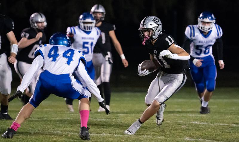 Kaneland’s Dominick DeBlasio (11) runs after the catch against Riverside Brookfield during a 6A playoff football game at Kaneland High School in Maple Park on Friday, Oct 28, 2022.