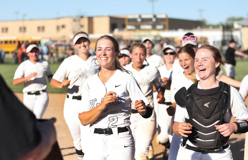 Kaneland captains Grace Algrim (left) and Corinne Pugh accept the sectional trophy after defeating Belvedere North Friday, June 3, 2022, in the IHSA Class 3A Sectional final game at Sycamore High School.