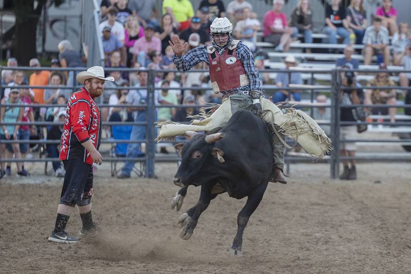 Hudson Bolton completes a qualifying ride Tuesday, August 15, 2023 in the Next Level Pro Bull Riding event at the Whiteside County Fair.
