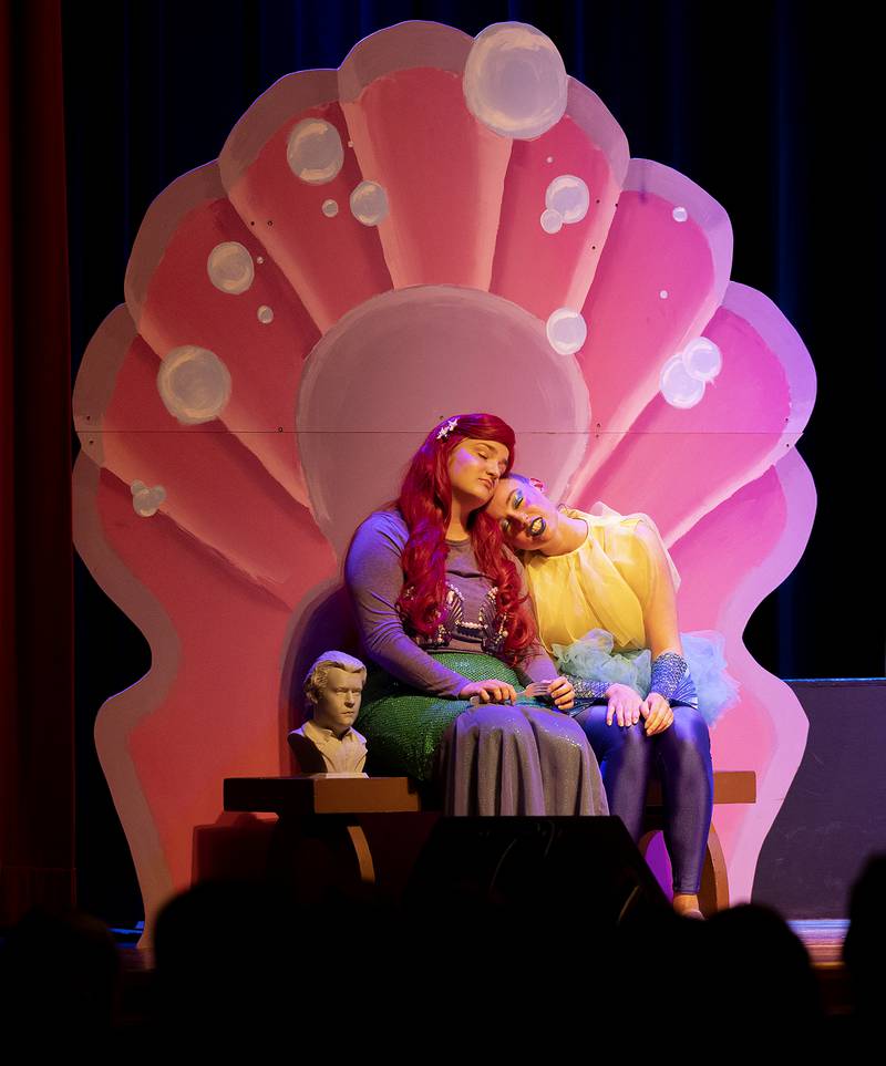 Ariel and Flounder act out a scene Friday, April 26, 2024 during Fulton High School’s “The Little Mermaid.”