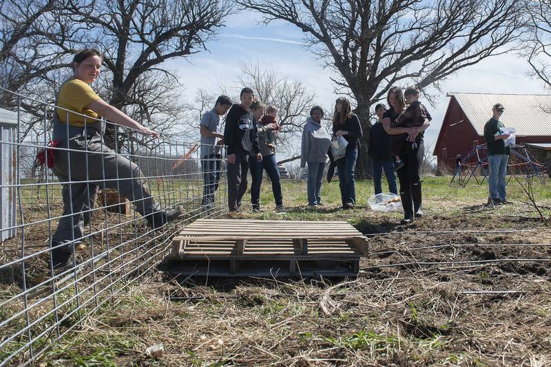 The foraging group checks out the mobile pig pen near the end of their tour on Thursday, April 21, 2022.
