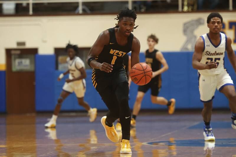 Joliet West’s Justus McNair works the ball upcourt against Joliet Central on Saturday, Jan. 27th, 2024 in Joliet.
