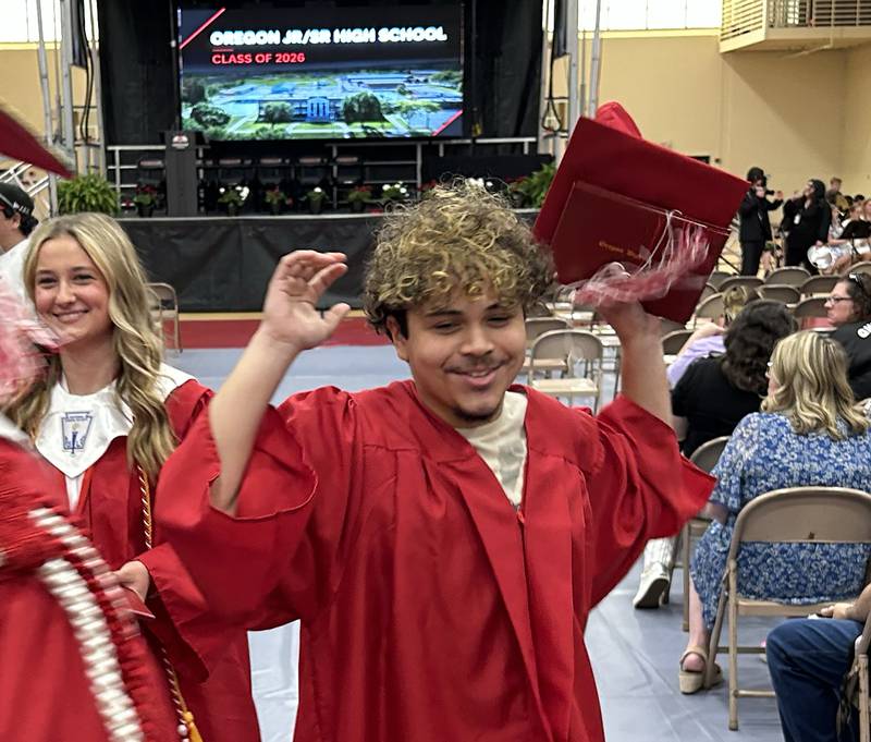 Oregon High School graduate Victor Cano Navo celebrates as he exits the gym at the end of  the Class of 2026 commencement ceremony at the Blackhawk Center in Oregon on Sunday, May 24, 2026.